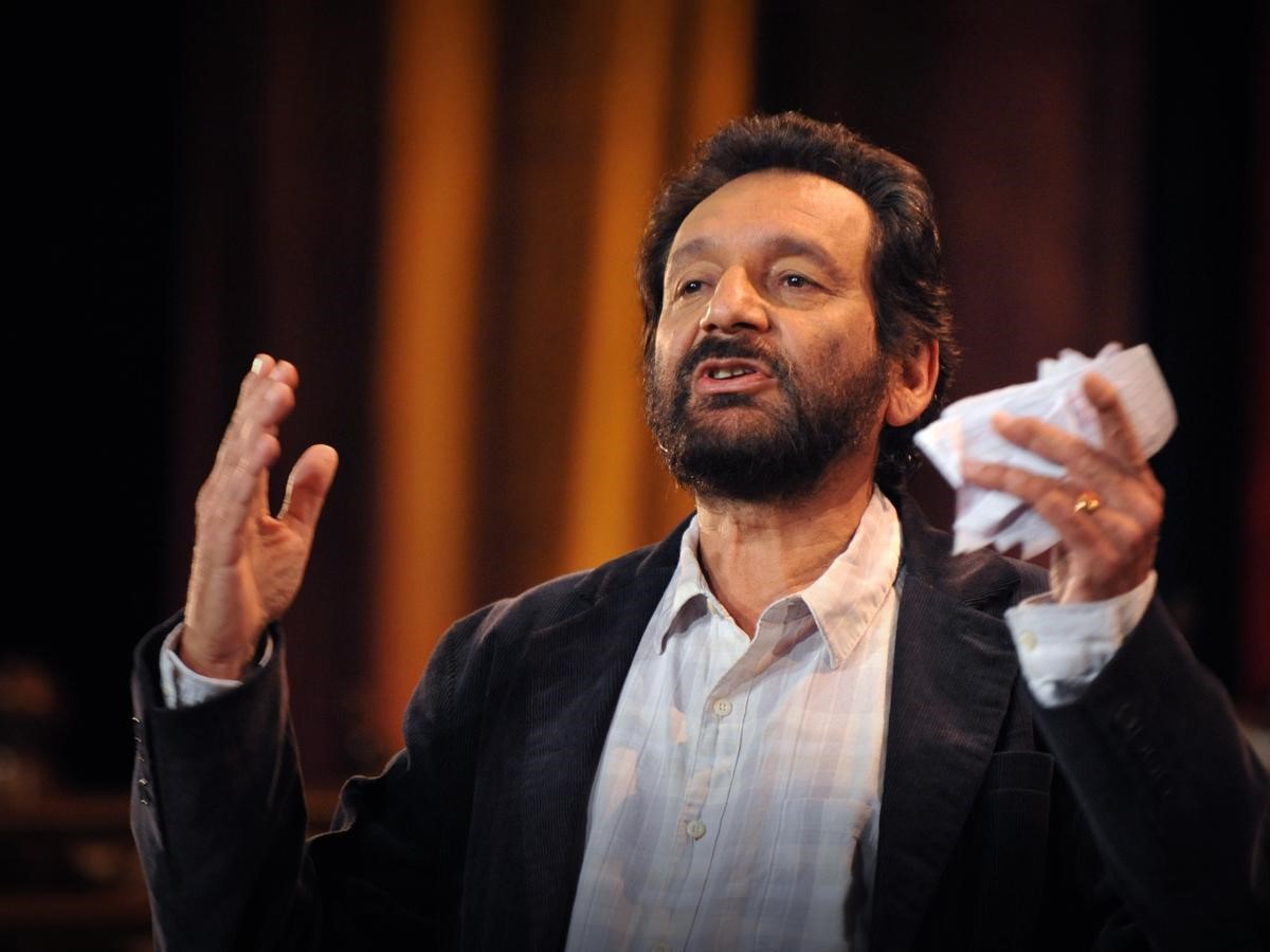 Shekhar Kapur gestures while telling a story, illustrating when it is that stories help us heal